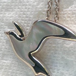 Mother of pearl design on sterling silver bird with chain